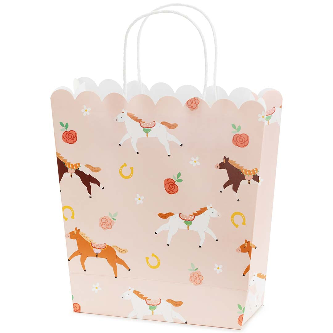Partydeco roze papieren cadeautasje met paarden, bloemen en hoefijzers.