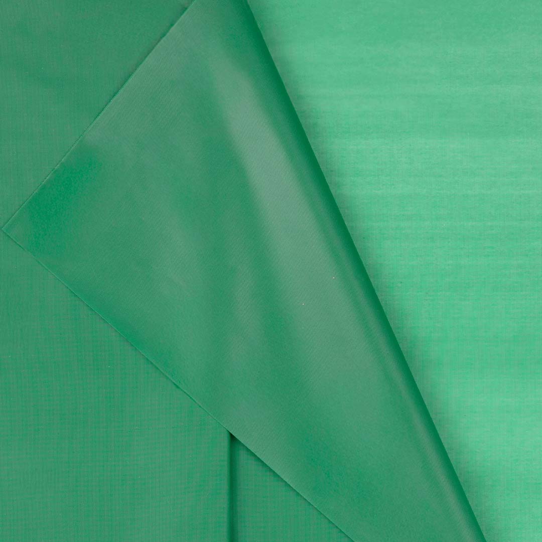 Detail van het donkergroene plastic PartyDeco tafelkleed met textuur.