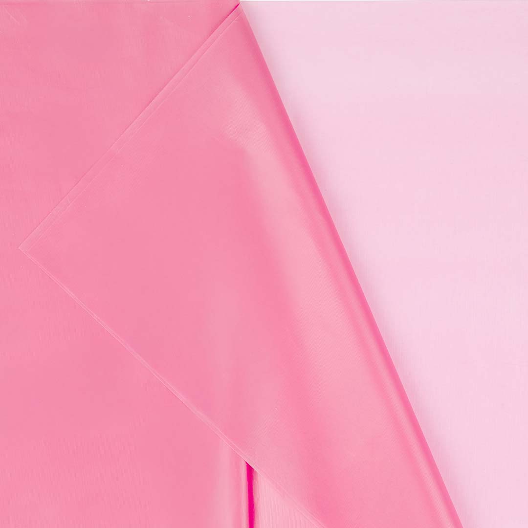 Detail van het roze plastic PartyDeco tafelkleed met lichte textuur.