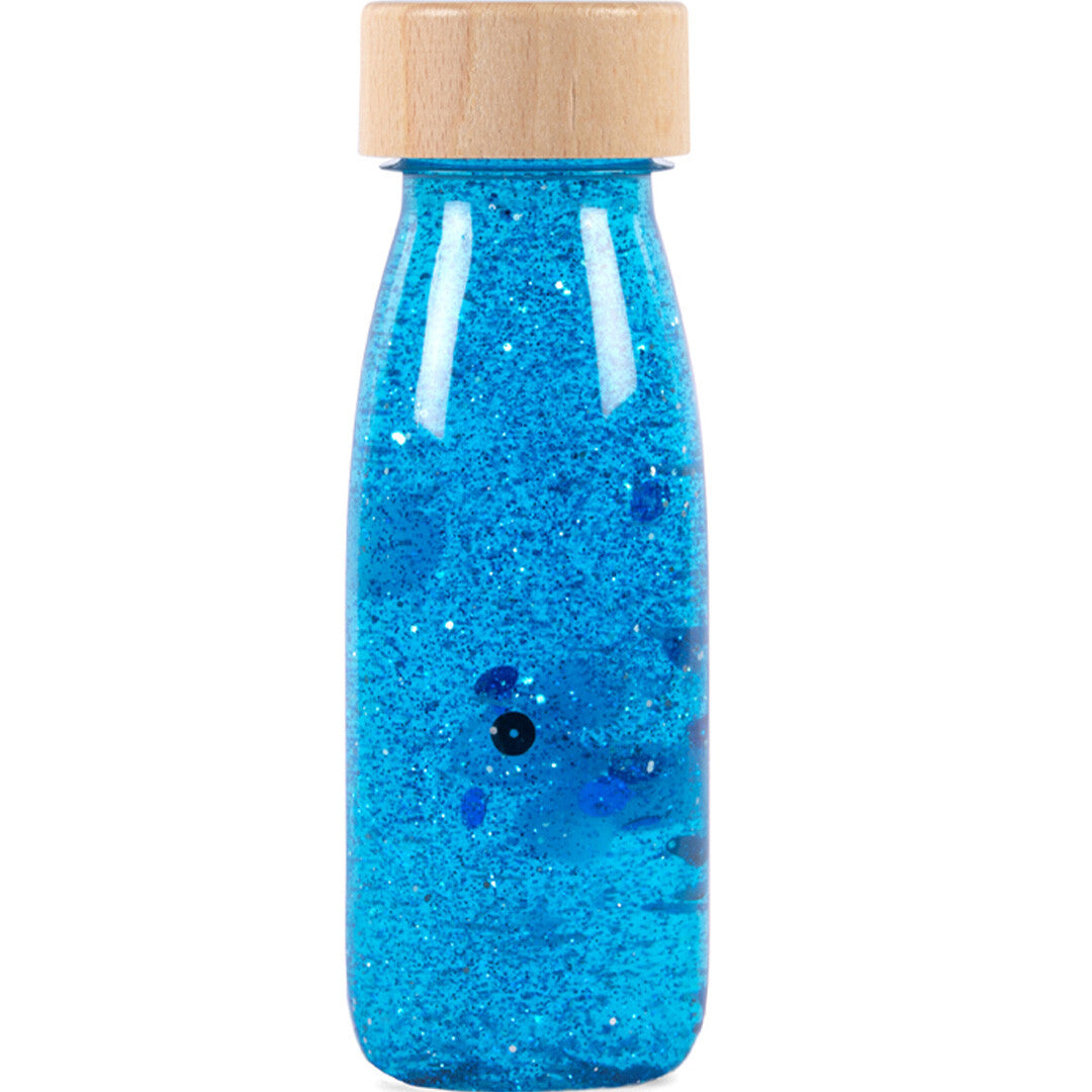 Petit Boum blauwe sensorische fles met glitter en houten dop.