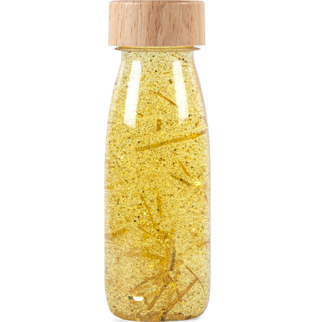 petit boum sensorische fles met gouden vulling en houten dop.