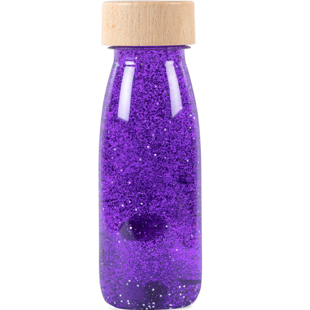 Petit Boum sensorische fles met paarse glitters en een houten dop.