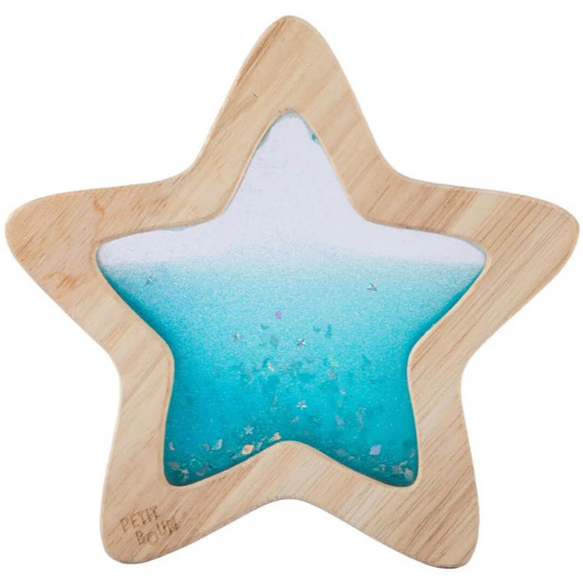 Petit Boum houten sensorische ster met blauwe vloeistof en glitters.