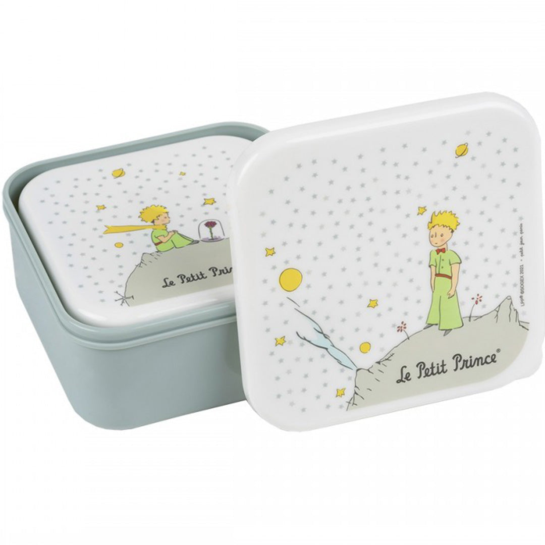 Twee Petit Jour snackdoosjes met de Kleine Prins, waarvan één open.