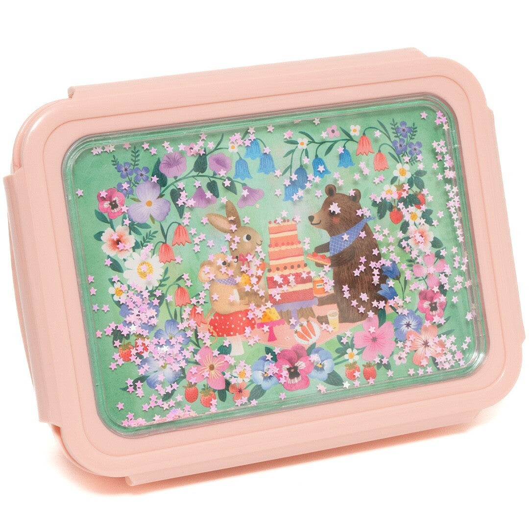 Detail van de Petit Monkey roze kinderbroodtrommel met een dieren picknick en bloemenpatroon op de deksel.