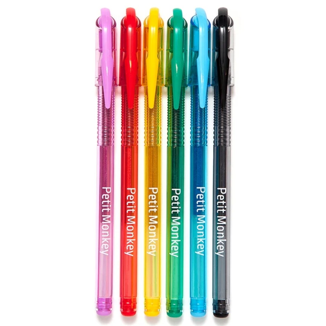 Zes Petit Monkey glitter gelpennen in verschillende kleuren, naast elkaar liggend.