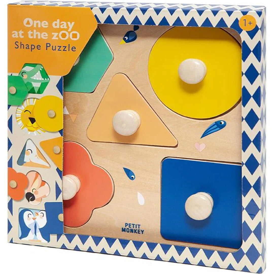 Verpakking van de Petit Monkey houten vormenpuzzel 'One day at the Zoo' met dierengezichten en geometrische vormen.