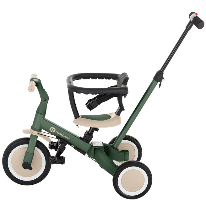 Petite&Mars 5-in-1 kinderfiets in driewielerstand met duwstang en veiligheidsbeugel, in het groen.