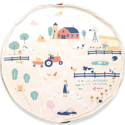Het play&go speelkleed met boerderijthema is volledig uitgevouwen en toont een gedetailleerde boerderijscène.