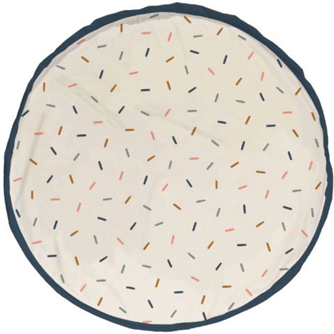 Het ronde play&go speelkleed met confetti-patroon, volledig uitgespreid.