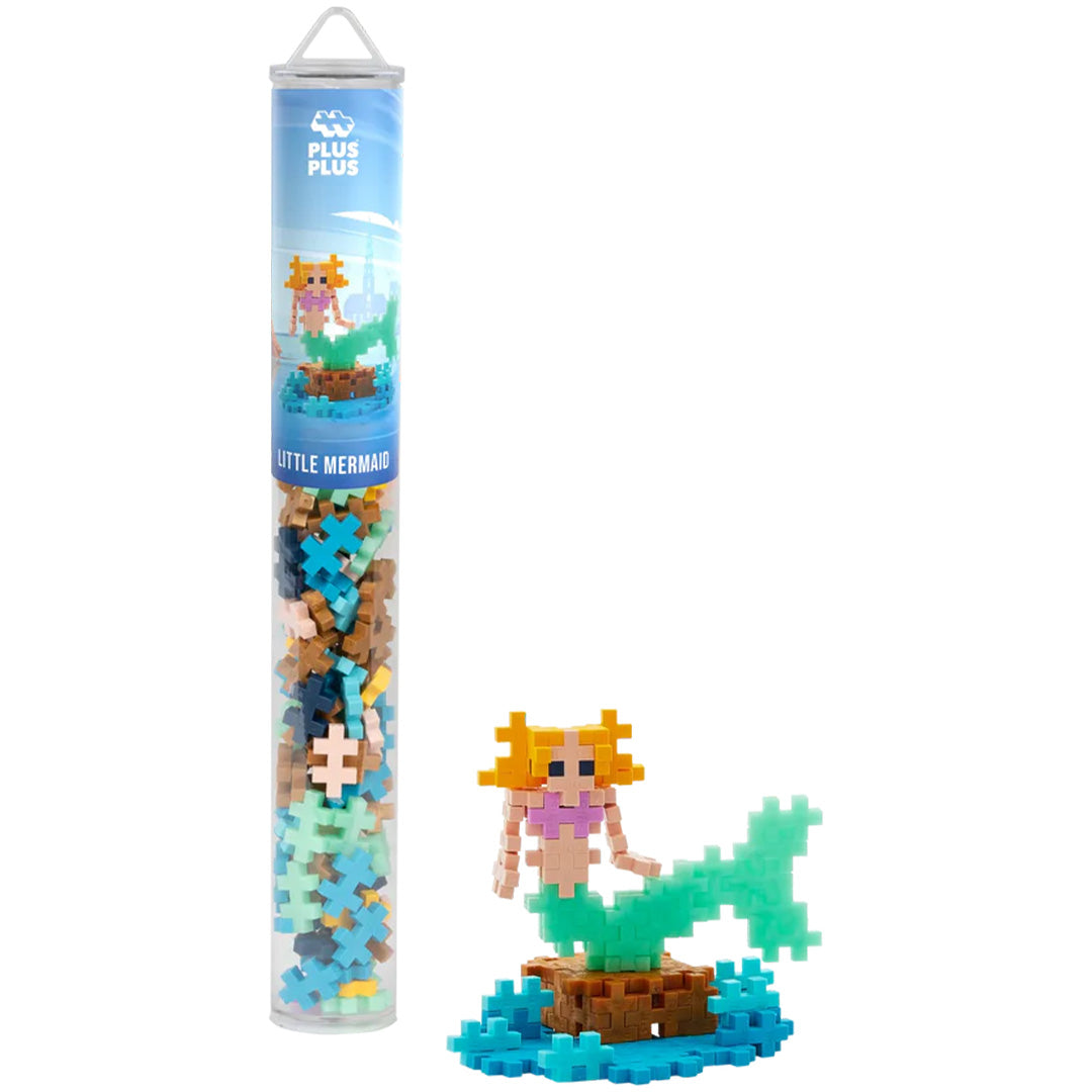 Plus-Plus bouwblokken zeemeermin set met de verpakkingstube en een gebouwde zeemeerminfiguur.