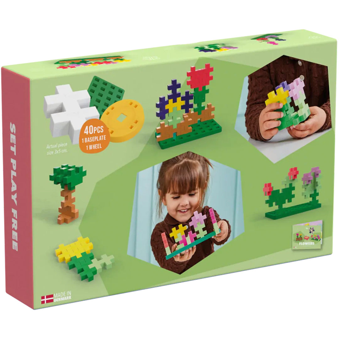 Achterkant van de Plus-plus BIG Flowers activity set verpakking met voorbeelden van bloemencreaties en spelende kinderen.