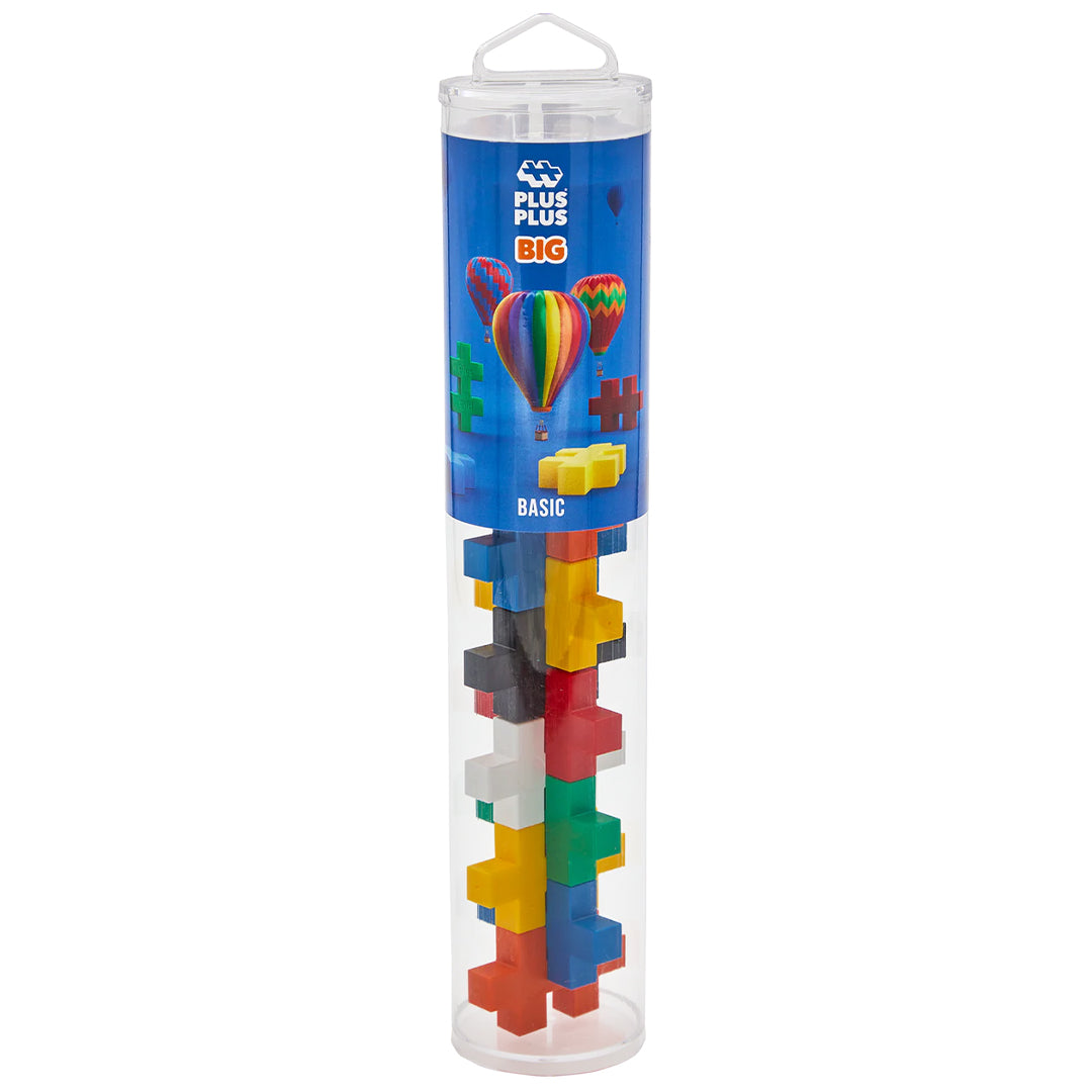 Verpakking van Plus-Plus BIG Basic bouwstenen in een transparante koker met kleurrijke blokken.