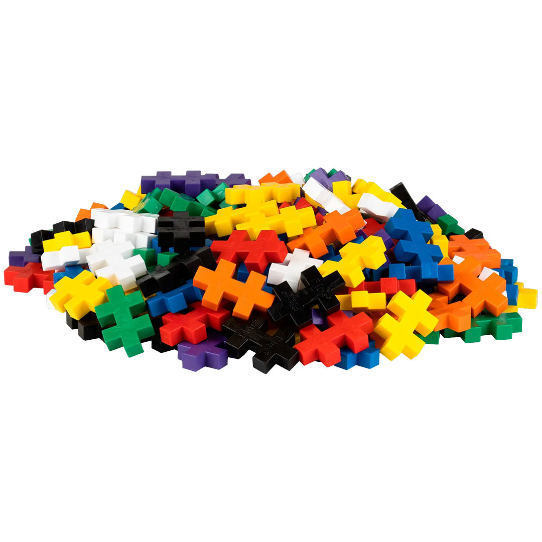 Een grote hoop kleurrijke Plus-Plus BIG bouwstenen in verschillende kleuren.