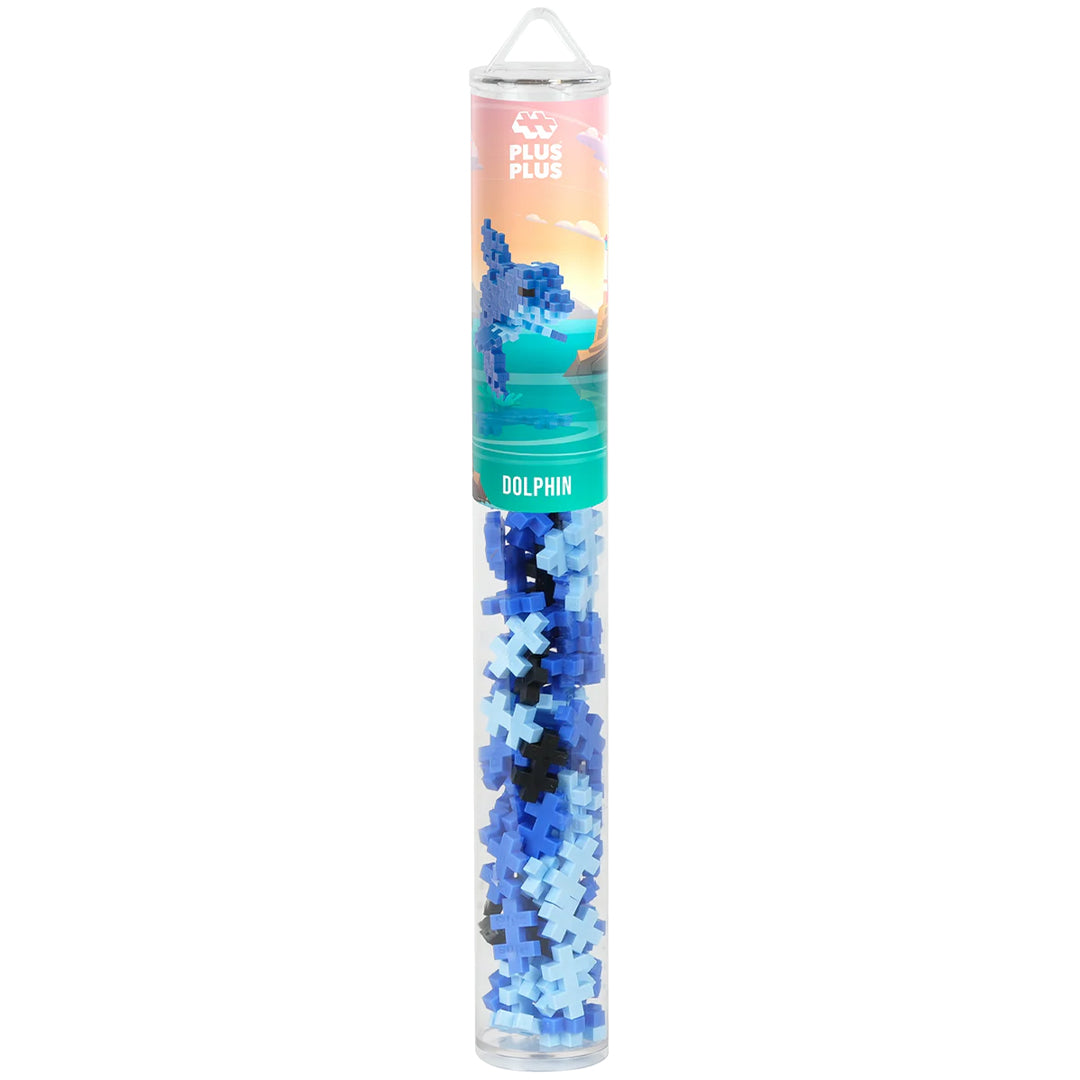 Plus-Plus bouwblokken dolfijn set in een transparante kokerverpakking met blauwe, lichtblauwe en zwarte bouwstenen.