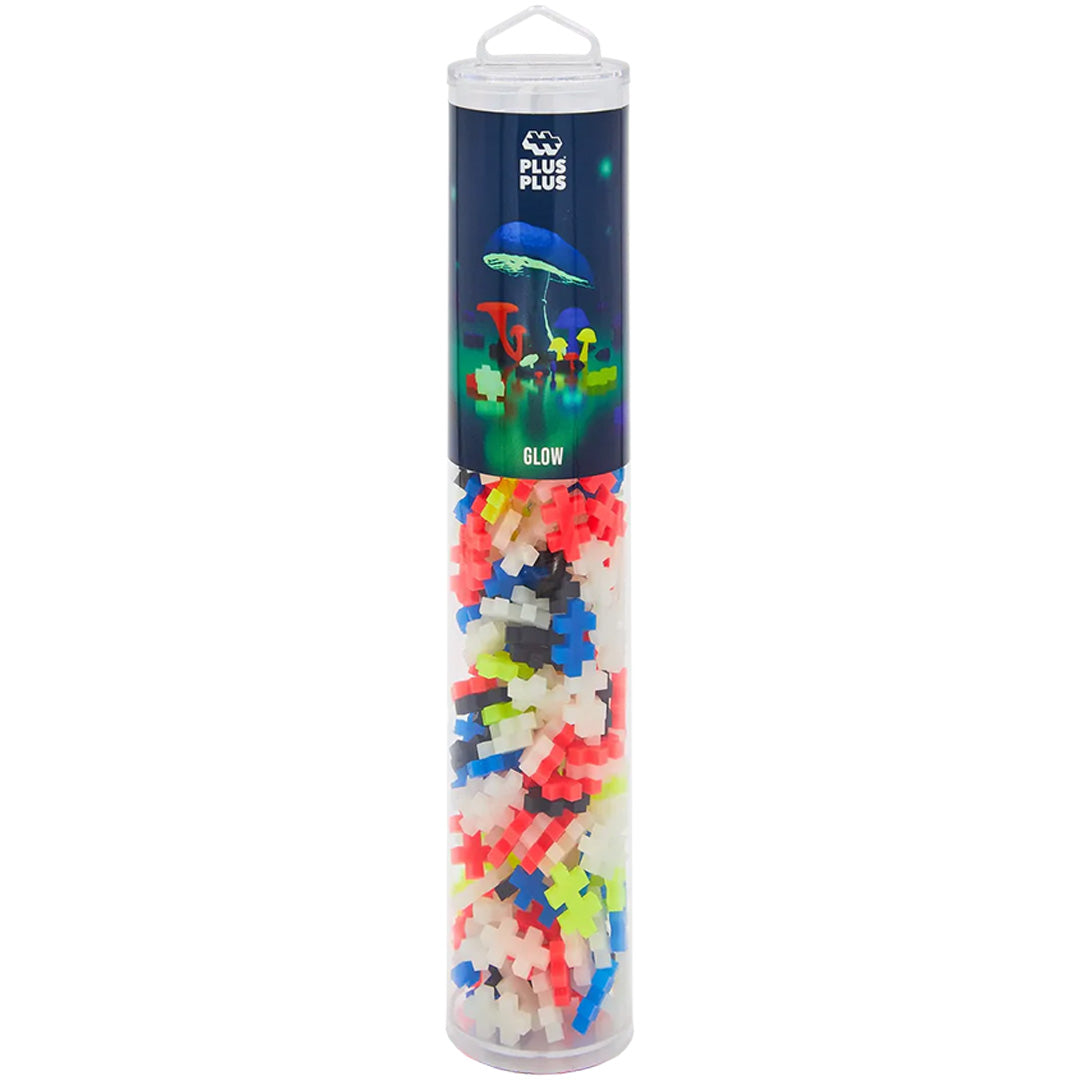 Plus-Plus bouwblokken glow mix in een transparante cilindervormige verpakking met label van lichtgevende paddenstoelen.