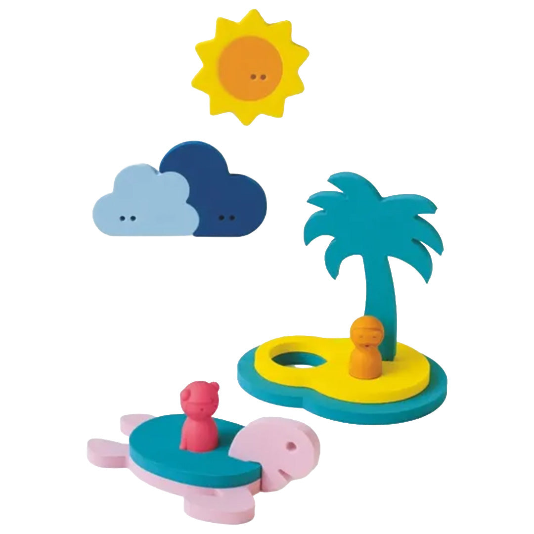 Quut badfiguren schateiland met zon, wolken, eiland met palmboom en schildpad.