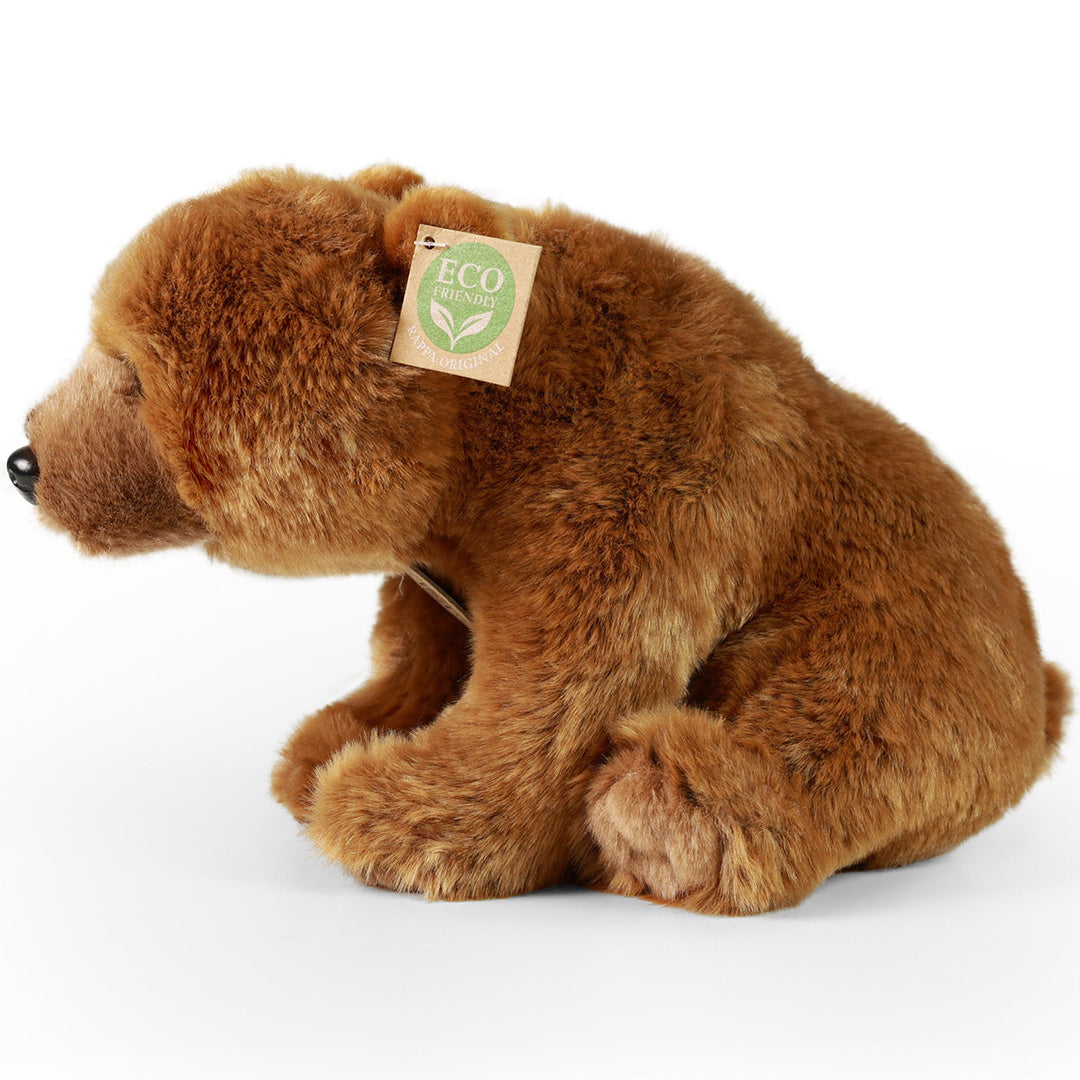 Rappa pluchen grizzlybeer, zittend en van de zijkant gefotografeerd, met 'Eco Friendly' label.