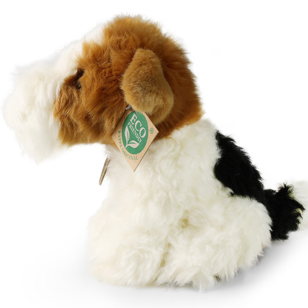 Pluchen fox terrier knuffelhond van Rappa, wit met bruine en zwarte vlekken, van de zijkant gezien.