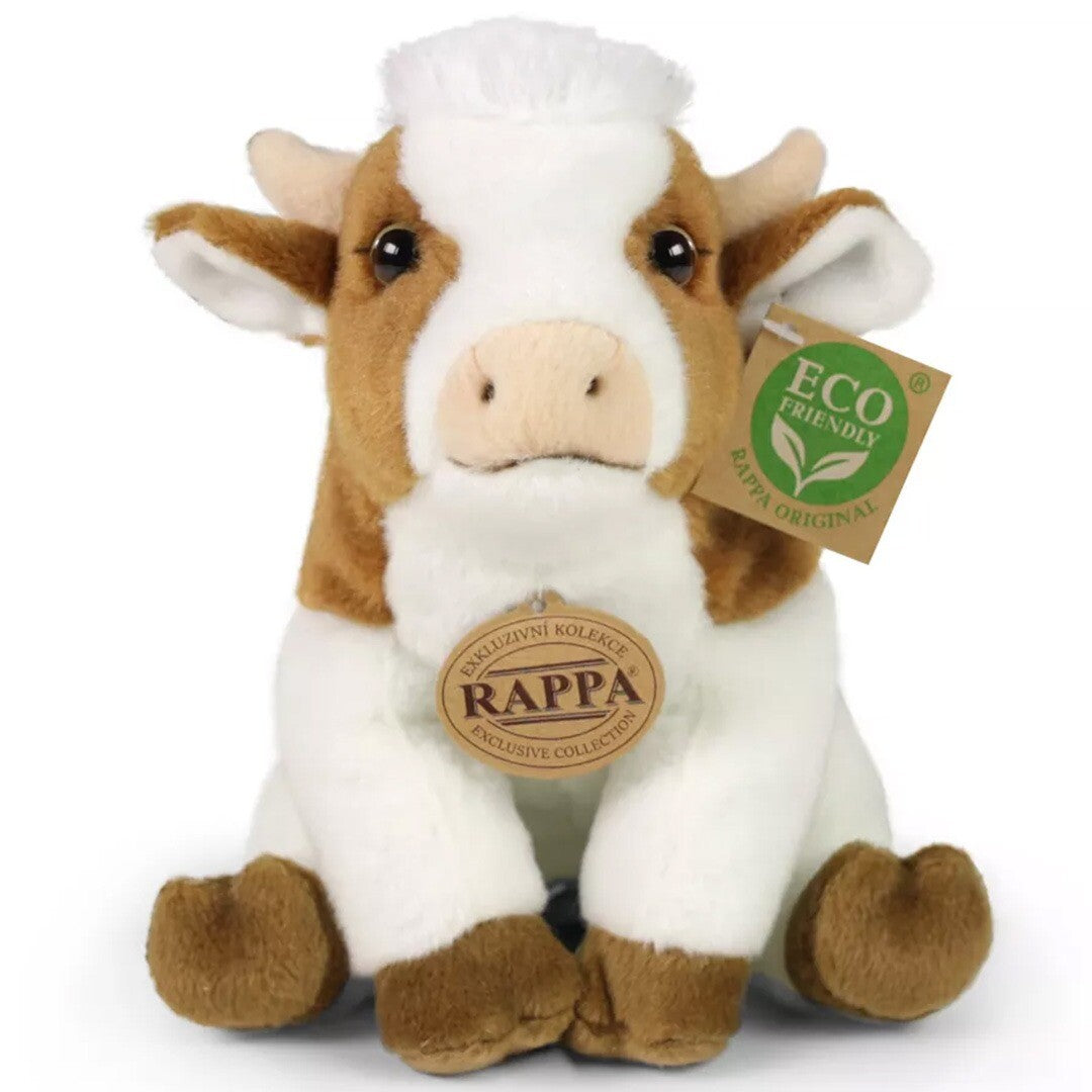 Rappa pluchen koe, bruin en wit, zittend en van voren gefotografeerd.