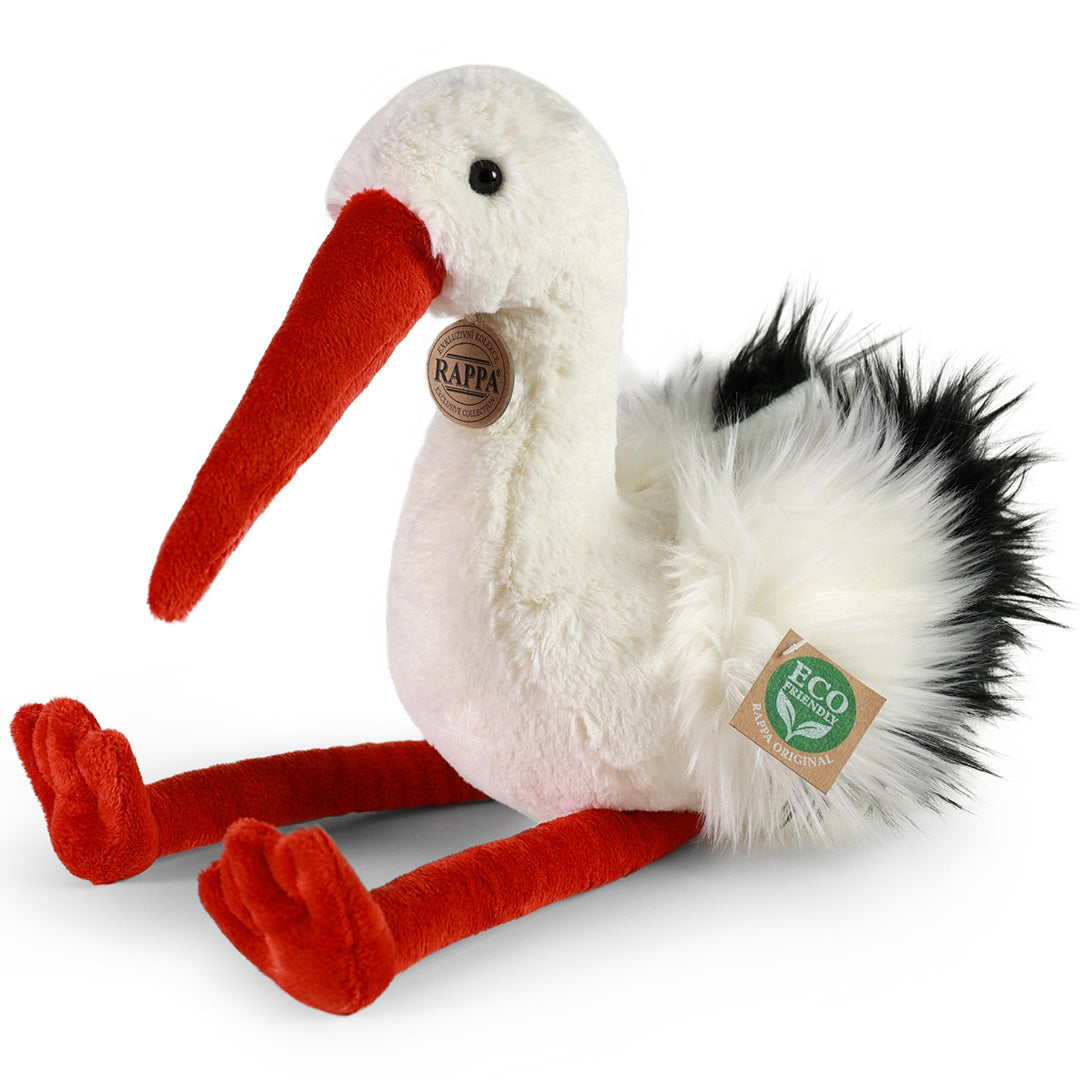 Rappa knuffelooievaar met witte vacht, rode snavel en poten, zittend op een witte achtergrond.