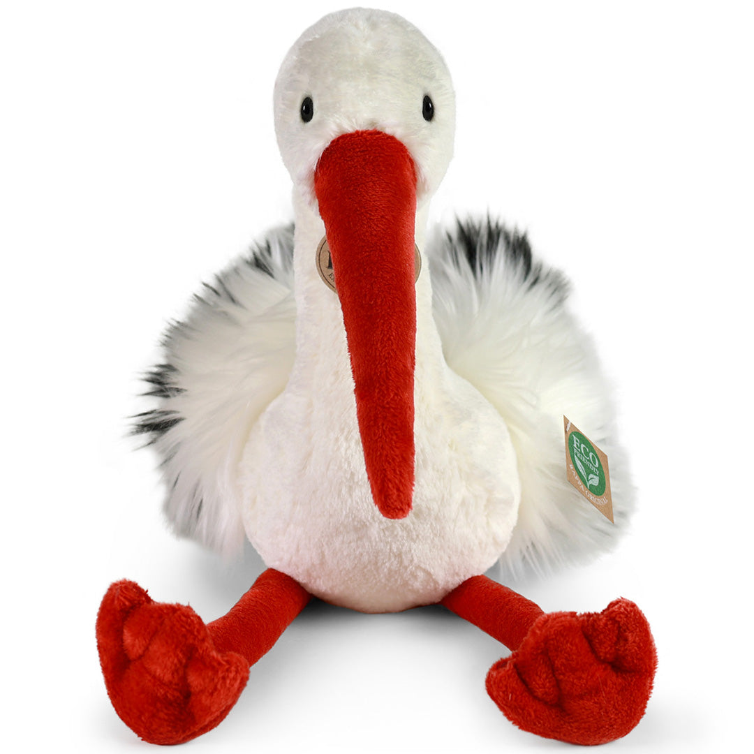 Rappa knuffelooievaar met witte vacht, rode snavel en poten, van voren gezien op een witte achtergrond.