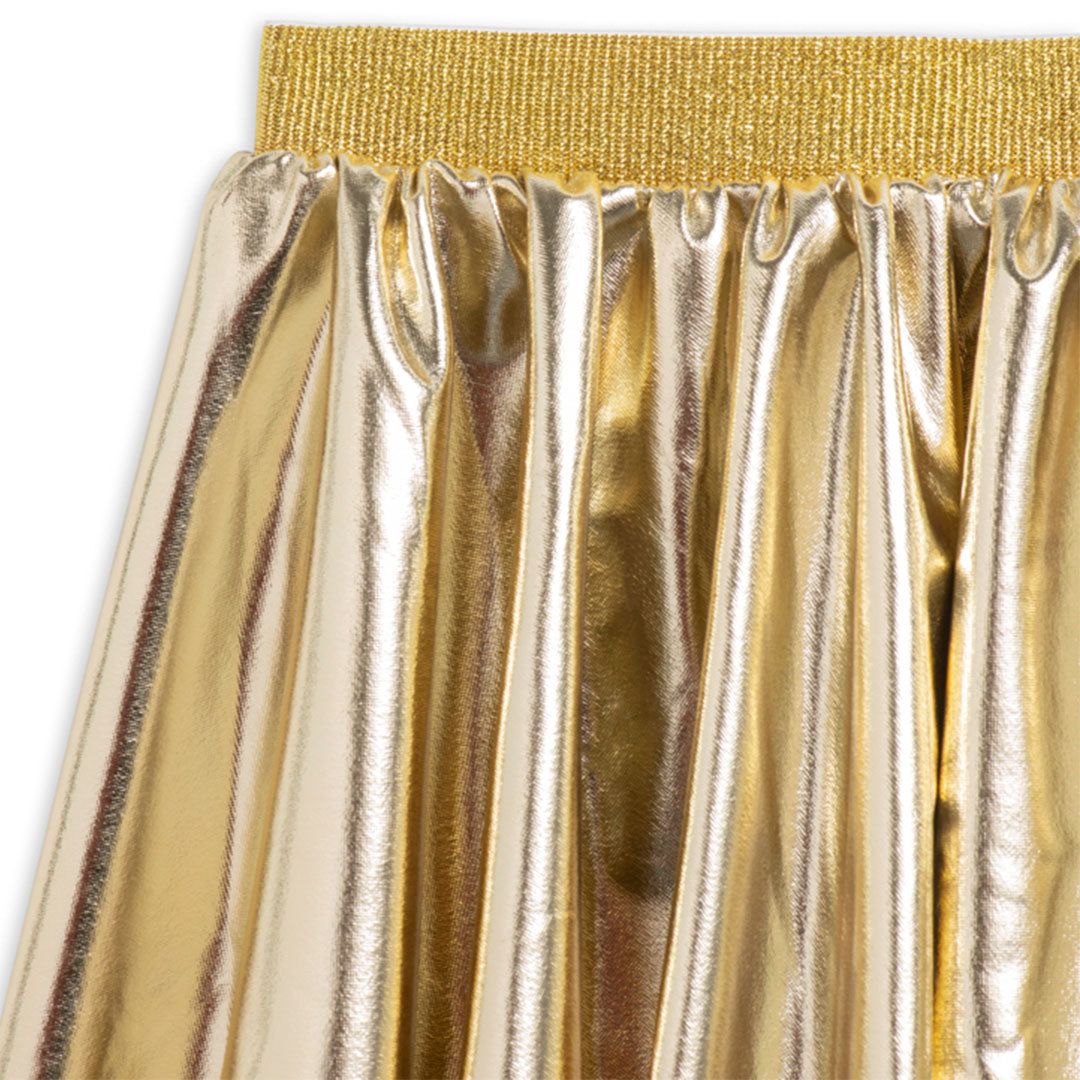 Detail van de ratatam metallic gouden kinderrok met glimmende stof en elastische tailleband.