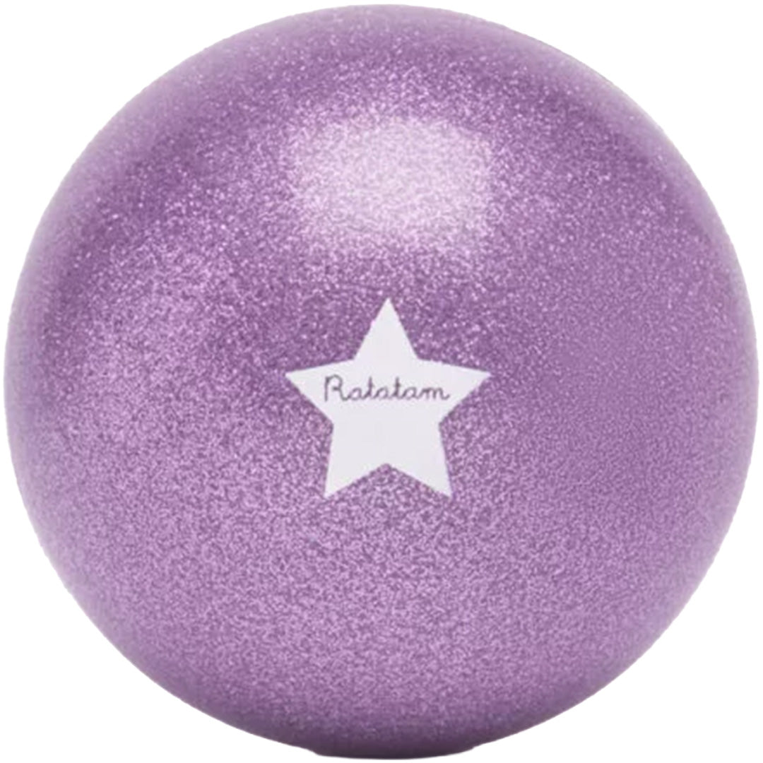 Een close-up van een paarse Ratatam glitter speelbal met een witte ster.