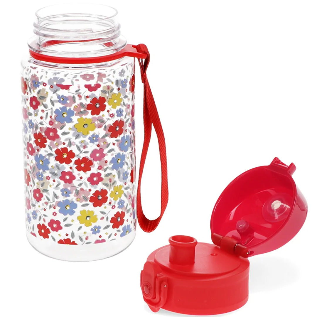 Rex London kinder drinkfles met bloemenpatroon, waarvan het rode deksel ernaast ligt.