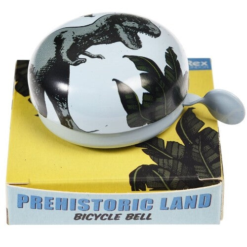 Rex London fietsbel met dinosauruspatroon op de gele verpakking met de tekst 'Prehistoric Land Bicycle Bell'.