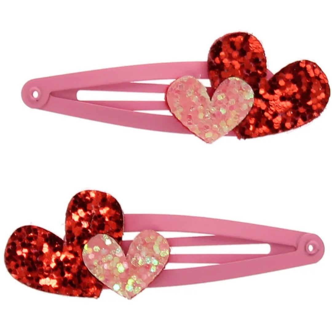 Twee Rex London roze haarspeldjes met rode en lichtroze glitterharten.