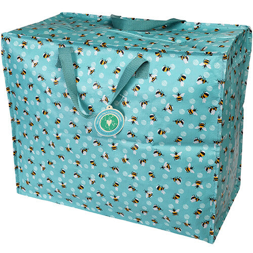 Rex London jumbo opbergtas met bijenpatroon en een productlabel aan het handvat.