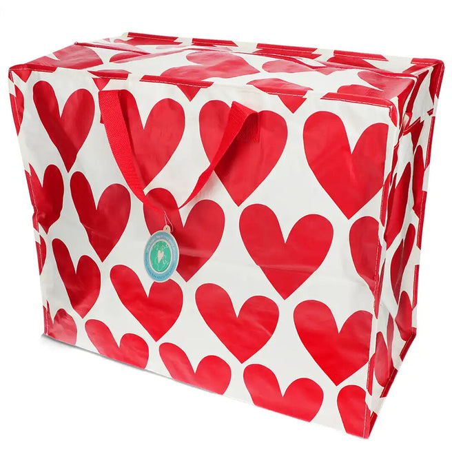 Rex London jumbo opbergtas met rood hartenpatroon, schuin gefotografeerd.