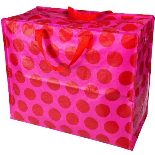 Rex London jumbo opbergtas met rode stippen op roze, schuin gefotografeerd.