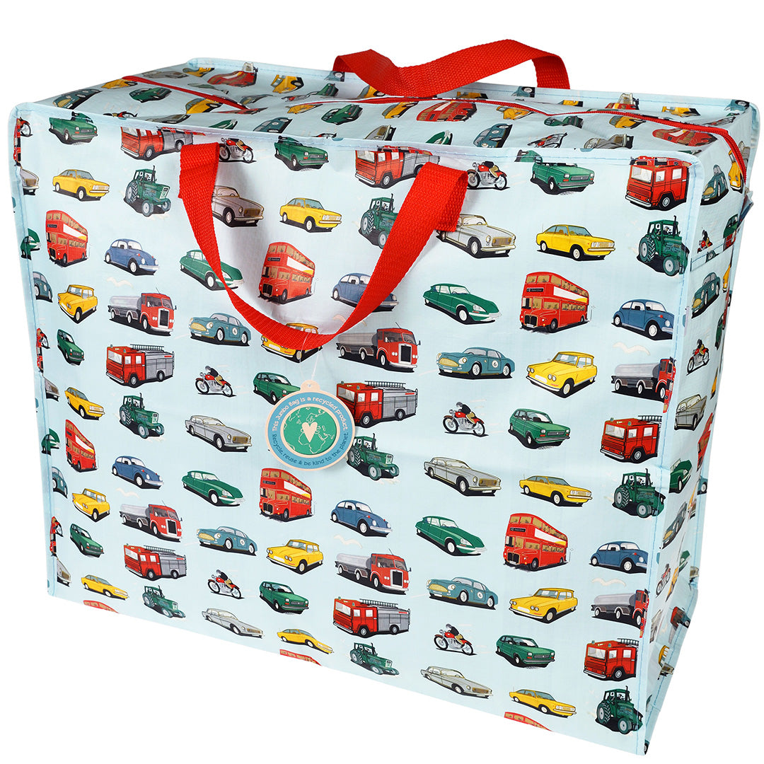 Rex London jumbo opbergtas van blauw plastic met een patroon van diverse voertuigen en rode handvatten.