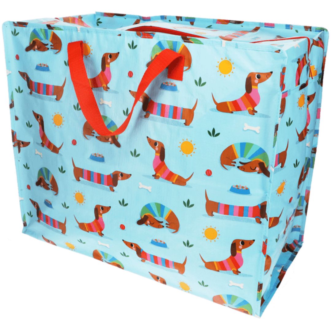 Rex London blauwe jumbo opbergtas met een patroon van kleurrijke teckels en rode handvatten.