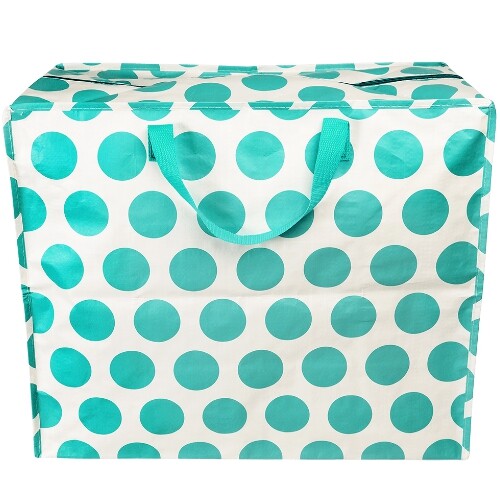 Rex London jumbo opbergtas met turquoise stippen en handvatten, recht van voren gefotografeerd.