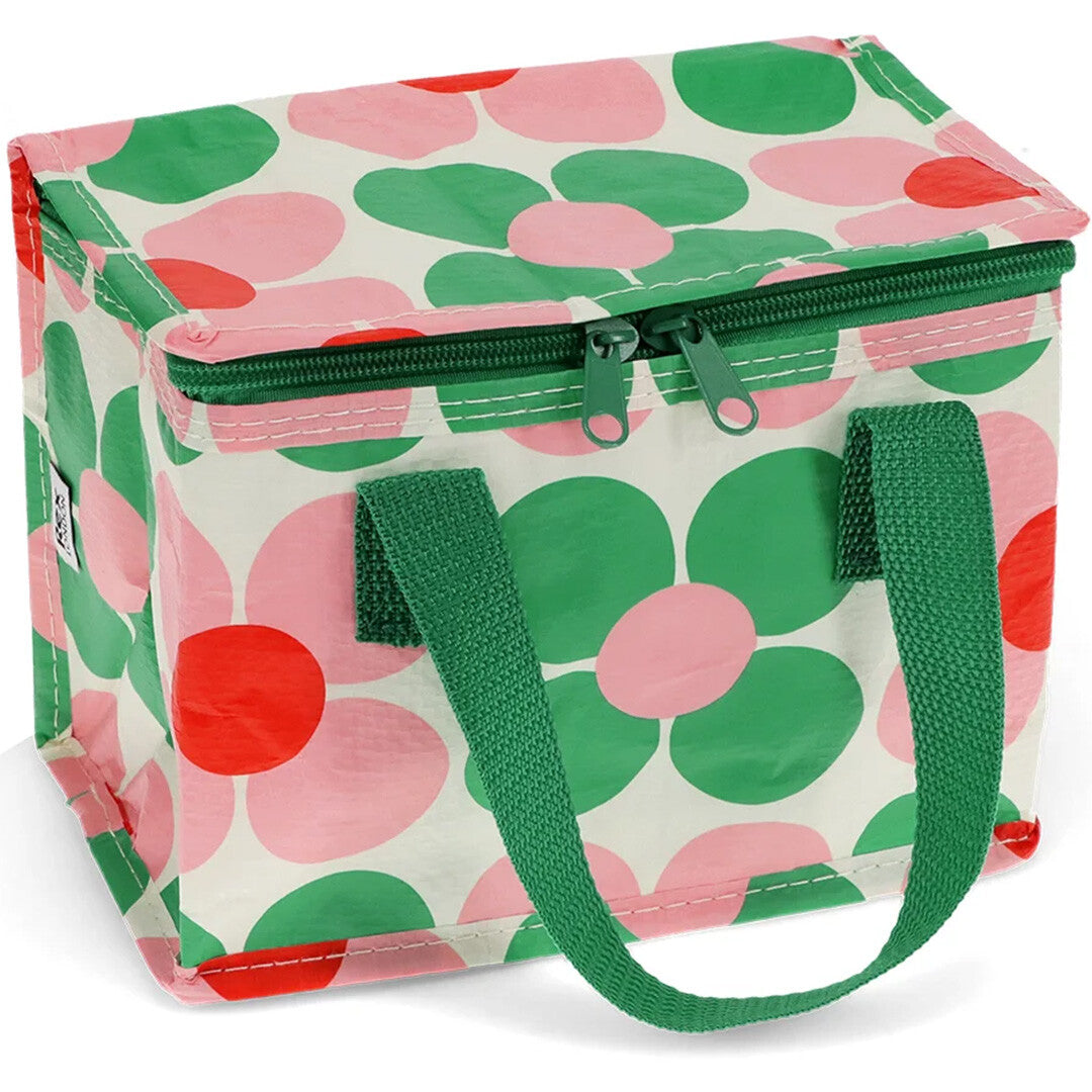 Rex London kinder lunchtas met roze en groene bloemenpatroon, schuin van bovenaf gefotografeerd.