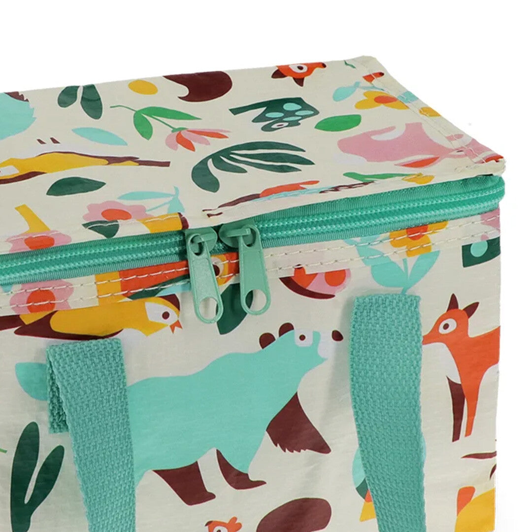 Detail van de Rex London lunchtas met rits en woodland dieren- en bloemenpatroon.