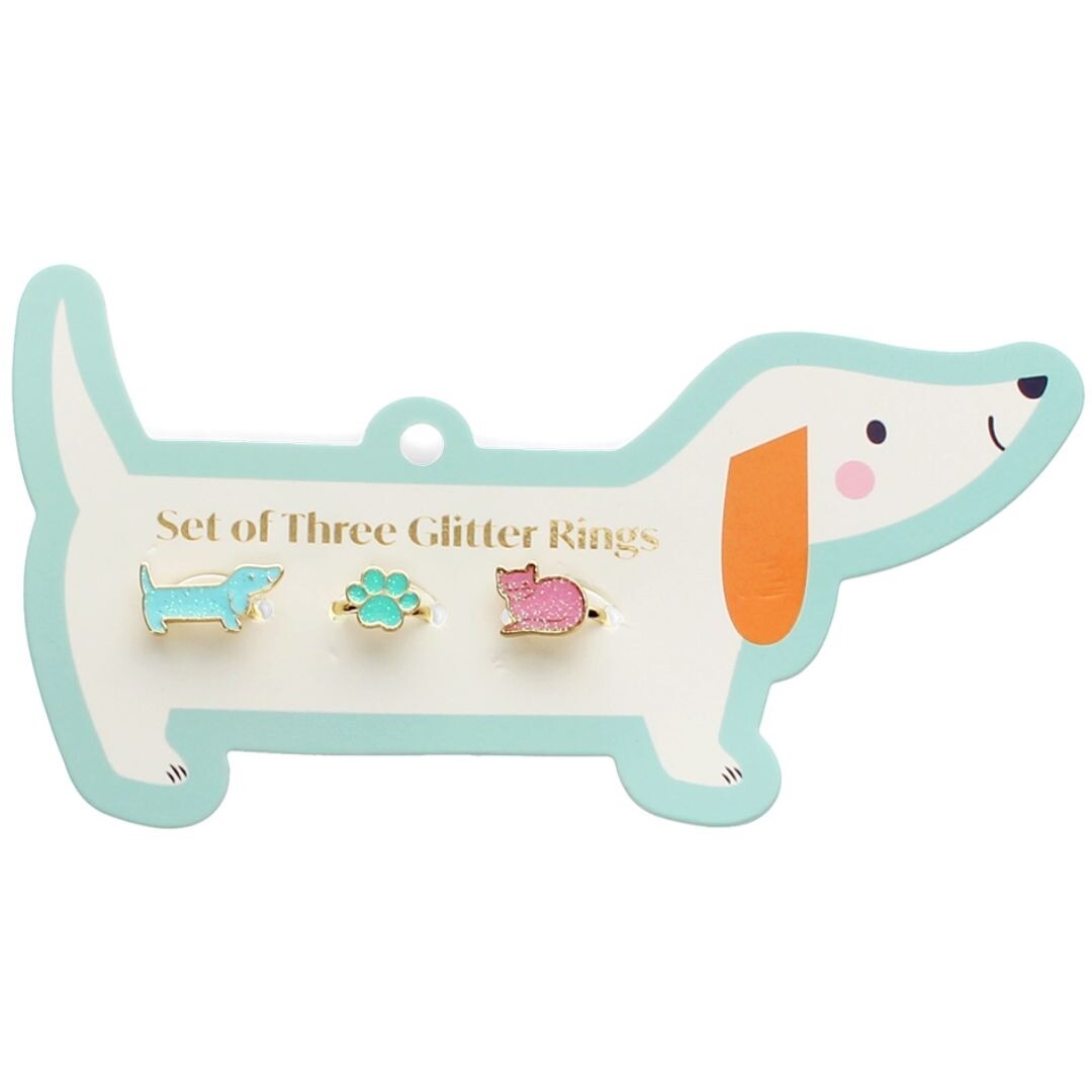 Rex London kinderringenset met glitter dierenringen op een hondvormige verpakking.
