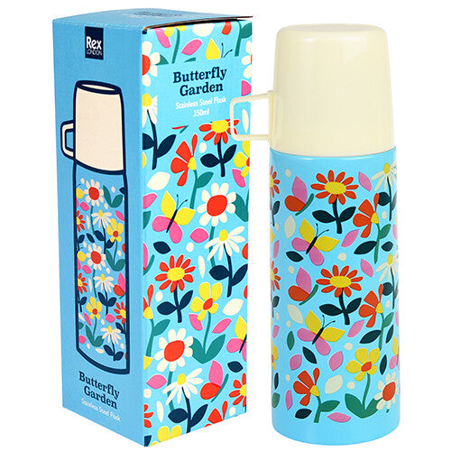 Rex London RVS thermosfles met bloemen- en vlinderpatroon naast de bijpassende verpakking.