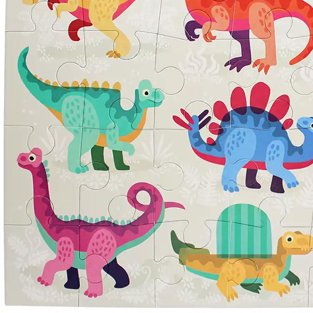 Detail van de Rex London vloerpuzzel met drie kleurrijke dinosaurussen.
