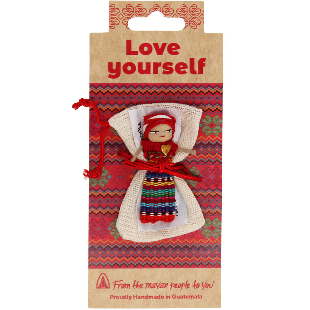 Verpakking van een Rex London zorgenpoppetje met etnisch patroon en de tekst 'Love yourself'.