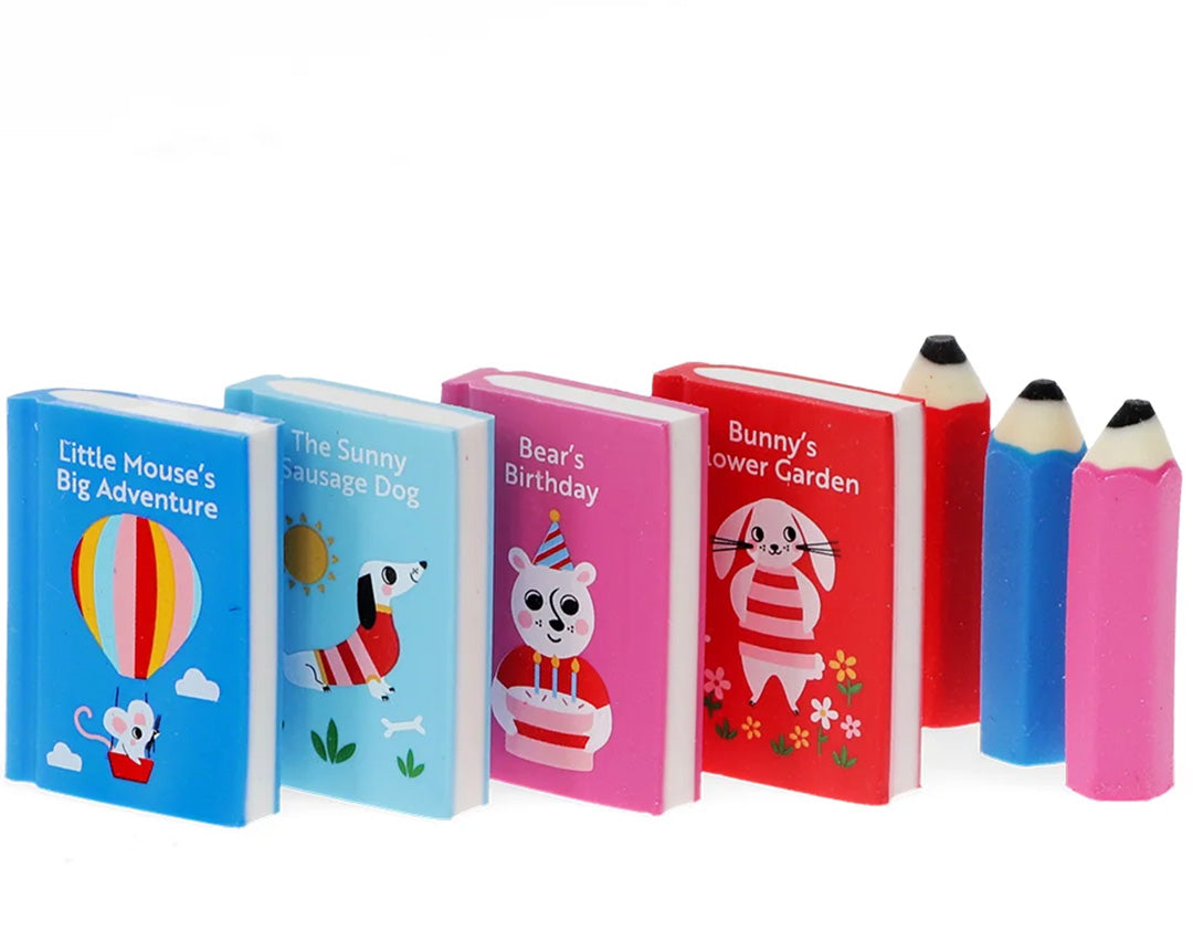 Een collectie van zeven Animal Tales gummen, waaronder vier boekvormige en drie potloodvormige gummen.