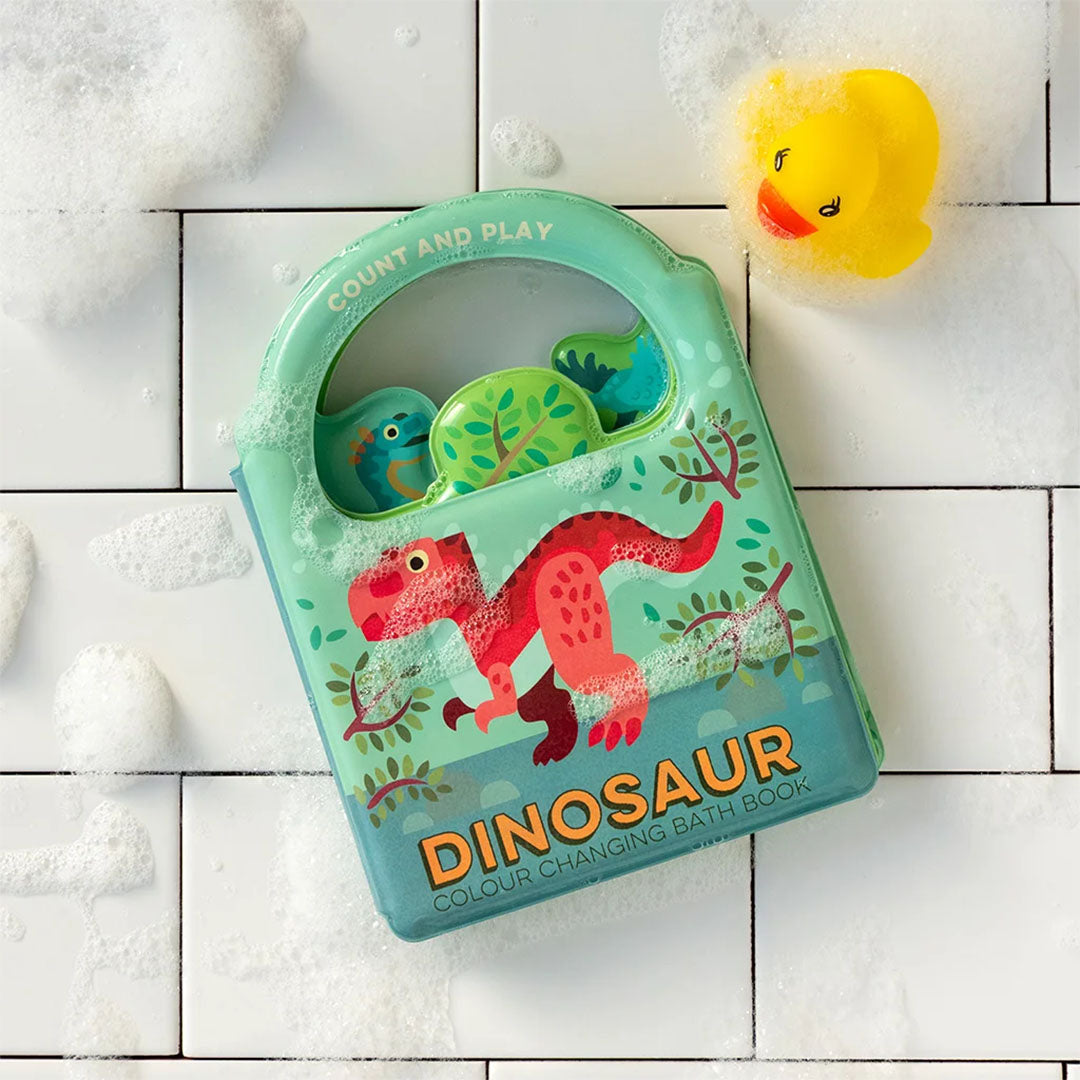 Gesloten Rex London badboekje met dinosaurus op de voorkant, liggend in badschuim naast een badeendje.