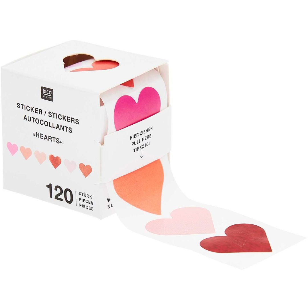 Rico Design rol stickers met holografische harten in verschillende roze- en roodtinten, deels uit de verpakking.