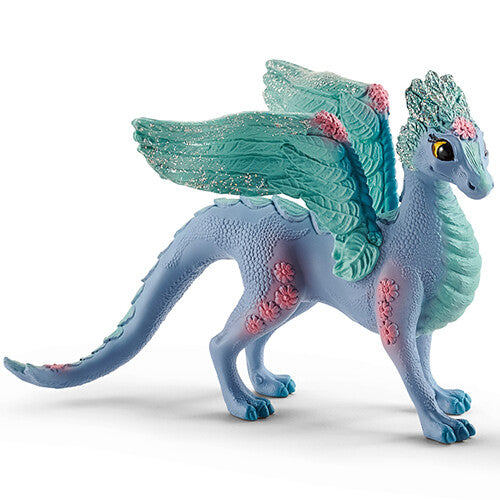 Schleich Bayala bloemendraak speelgoedfiguur, blauw met roze bloemen en glitterende teal vleugels.