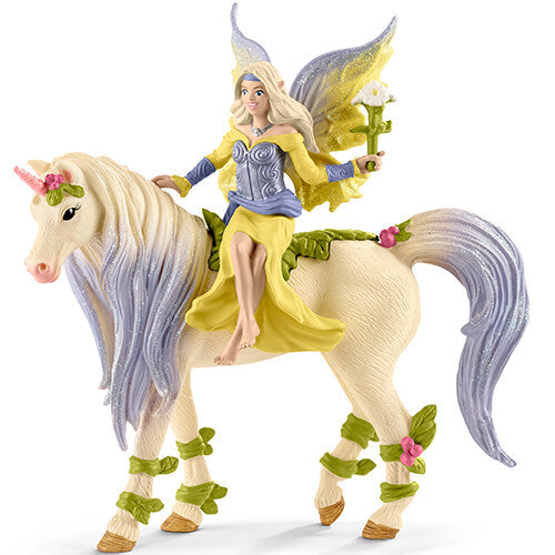 Schleich speelset van een beige bloemeneenhoorn met een fee in een gele jurk.