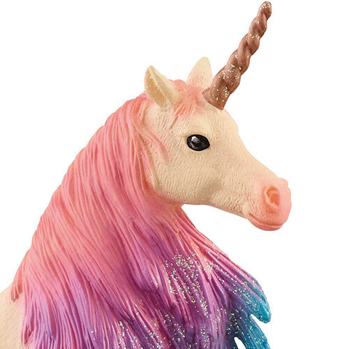 Detailopname van de kop en manen van het eenhoorn speelgoedfiguurtje, met roze, paarse en blauwe glittermanen.