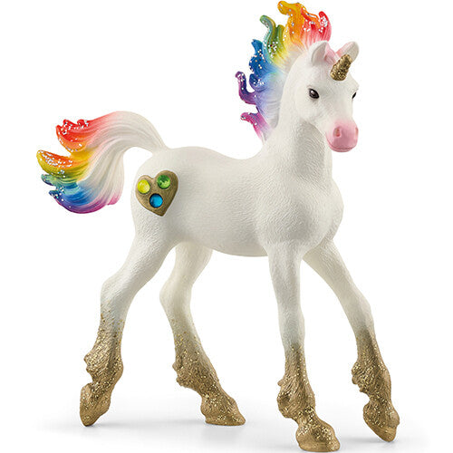 Schleich Bayala eenhoorn veulen met regenboogmanen, gouden hoeven en een hartje met edelstenen.